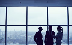 business people next to a window